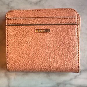 Relic pink peachy wallet paper money and coins